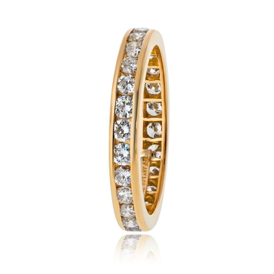 18K Yellow Gold Diamond Eternity Band Size 6 by Tiffany & Co.: 18K Yellow Gold Diamond Eternity Band Size 6 by Tiffany & Co. This Tiffany & Co. eternity wedding band is crafted in 18K yellow gold and set with round brilliant-cut diamonds totaling approximately 0.