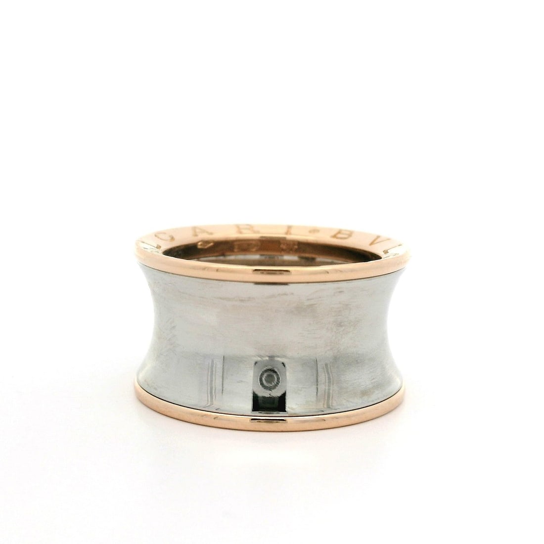 Bvlgari Anish Kapoor 18k Rose Gold Stainless Steel B.Zero1 Ring: Bvlgari Anish Kapoor 18k Rose Gold Stainless Steel B.Zero1 Ring This exquisite Bulgari Anish Kapoor B.Zero1 ring showcases a unique concave band design crafted from solid 18k rose gold paired with sta