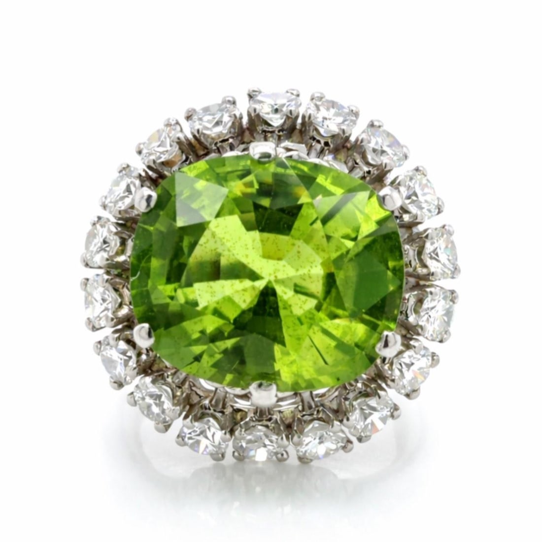 Vintage Platinum Ring Featuring 8 Carat Peridot and Diamond Accents Size 6.5: Vintage Platinum Ring Featuring 8 Carat Peridot and Diamond Accents Size 6.5 This 1960's platinum ring features an approximately 8.00 carat peridot as the centerpiece, complemented by 18 diamonds with