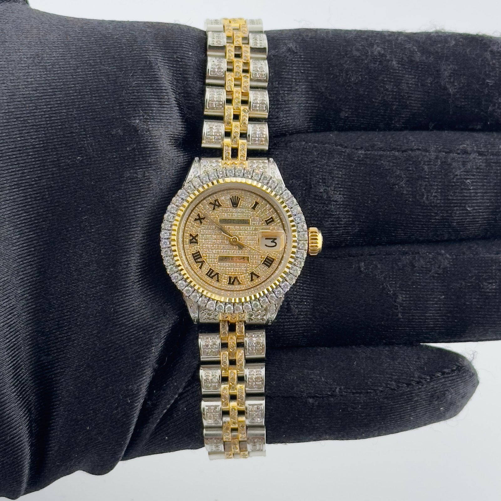 Ladies Datejust 6916 with Gold Roman Numeral Dial on Jubilee Bracelet: Ladies Datejust 6916 with Gold Roman Numeral Dial on Jubilee Bracelet This Rolex Datejust watch for ladies features a gold dial with Roman numeral hour markers, complemented by a prong plated bezel. T