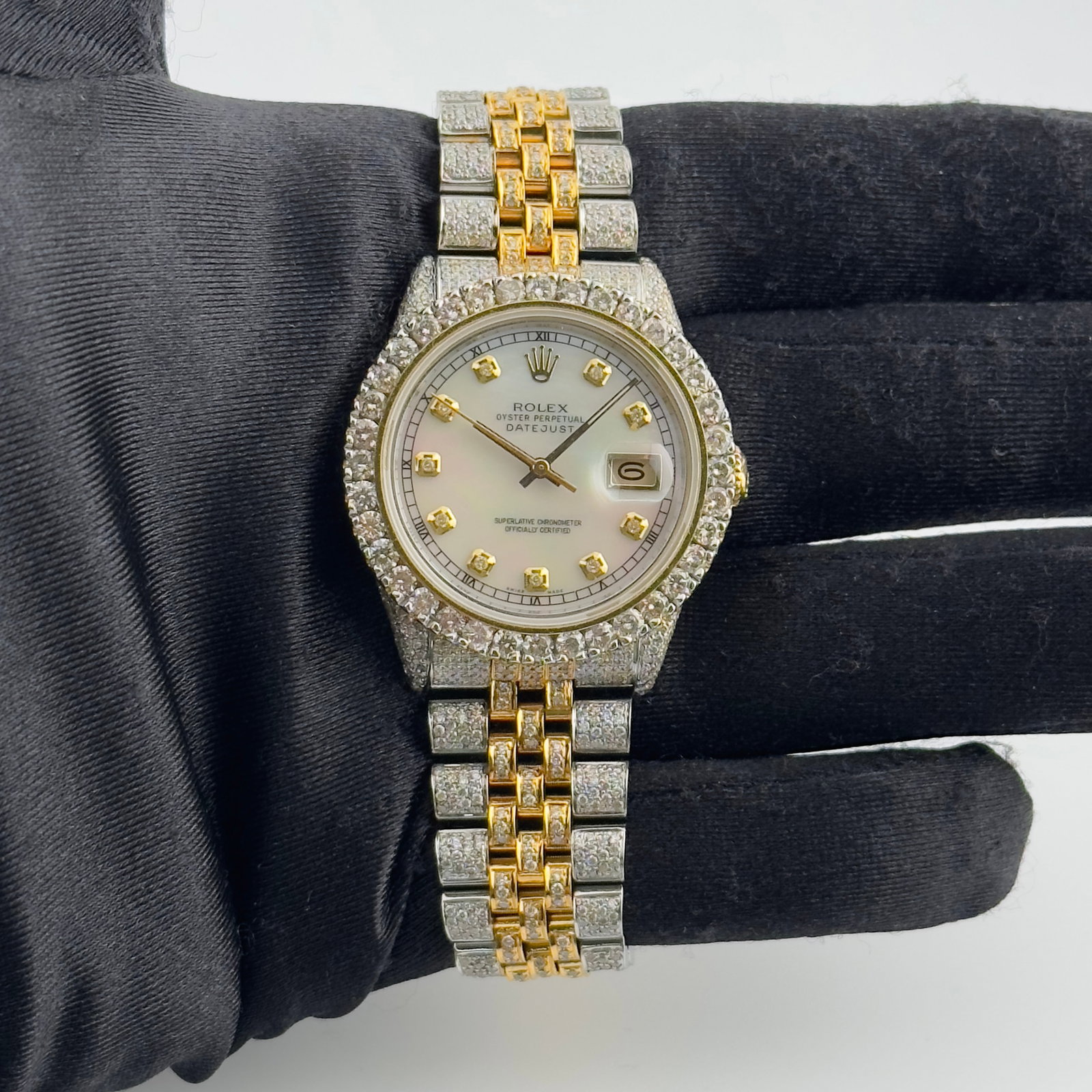 Rolex 16013 Datejust Men's Watch White MOP Diamond Dial Iced Jubilee Aftermarket: Rolex 16013 Datejust Men's Watch White MOP Diamond Dial Iced Jubilee Aftermarket This Rolex Datejust watch features a white mother-of-pearl diamond dial, complemented by an iced-out Jubilee bracelet. 