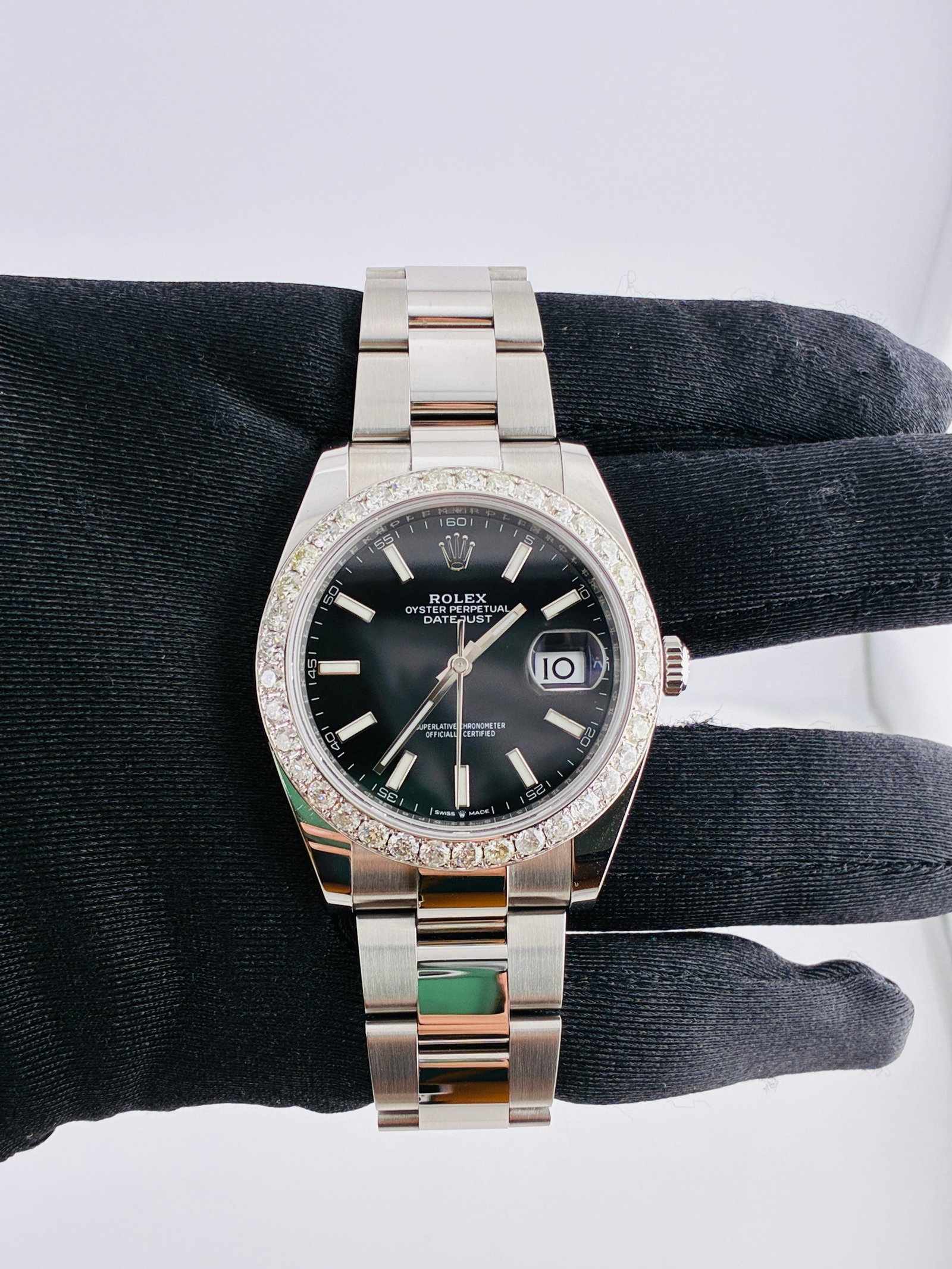 Datejust Reference 126334 Black Index Dial with Diamond Bezel Oyster Bracelet: Datejust Reference 126334 Black Index Dial with Diamond Bezel Oyster Bracelet This Rolex Datejust features a black index dial and is equipped with an Oyster bracelet. The model, reference number 12633