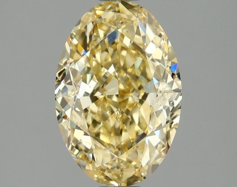 Loose Diamond - OVAL 2.1ct Fancy Vivid Yellow VS2: Loose Diamond - OVAL 2.1ct Fancy Vivid Yellow VS2 Source: This is a real non-mined Diamond that has been grown in a lab Shape: OVAL Carats: 2.1 Color: Fancy Vivid Yellow Certification: IGI Video: