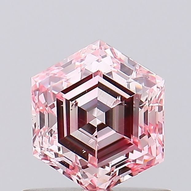 Loose Diamond - HEXAGONAL 0.73ct Fancy Intense Pink SI1: Loose Diamond - HEXAGONAL 0.73ct Fancy Intense Pink SI1 Source: This is a real non-mined Diamond that has been grown in a lab Shape: HEXAGONAL Carats: 0.73 Color: Fancy Intense Pink Certification: IGI