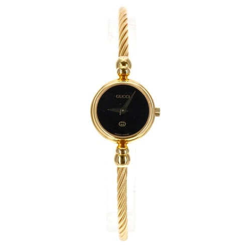 Gucci 2700L Ladies Bangle Bracelet Watch Black Dial: Gucci 2700L Ladies Bangle Bracelet Watch Black Dial This is a Gucci ladies' watch featuring a black dial and a bangle-style bracelet. The watch is identified by reference number 2700L and is part of G