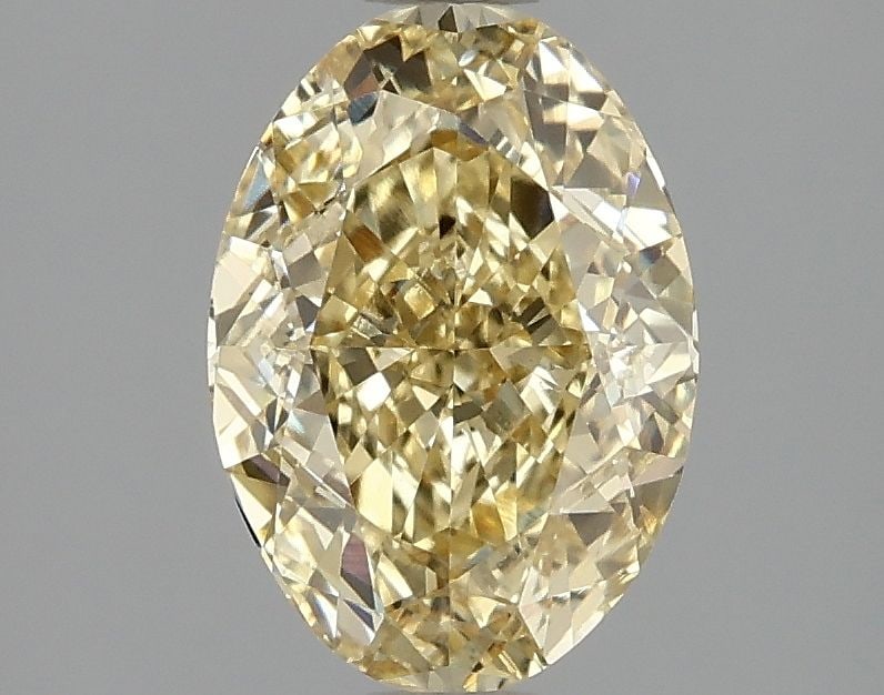 Loose Diamond - OVAL 2.09ct Fancy Vivid Yellow VVS2: Loose Diamond - OVAL 2.09ct Fancy Vivid Yellow VVS2 Source: This is a real non-mined Diamond that has been grown in a lab Shape: OVAL Carats: 2.09 Color: Fancy Vivid Yellow Certification: IGI Video: