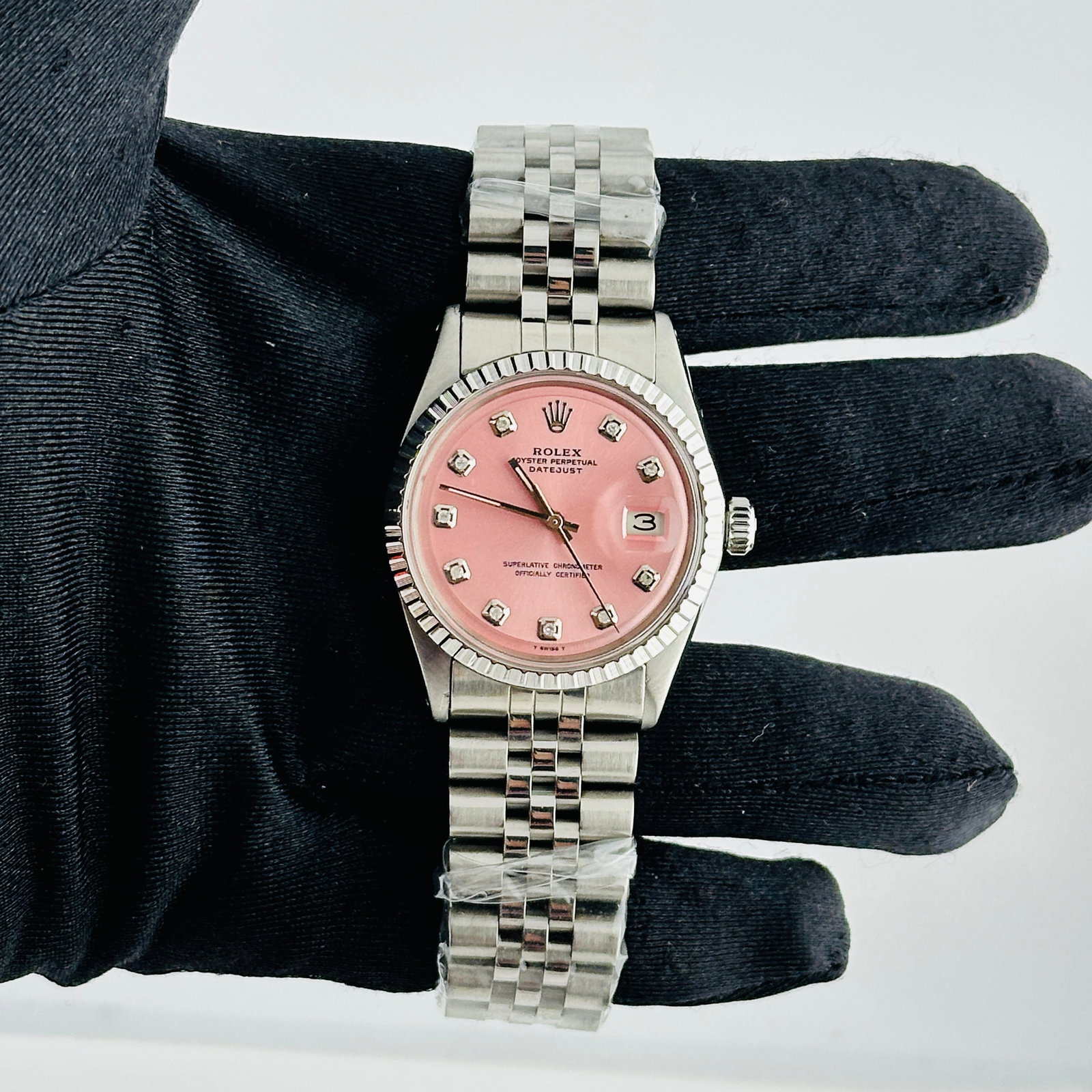 Rolex Datejust Ref 1601-3 Mens Watch With Aftermarket Pink Diamond Dial Jubilee: Rolex Datejust Ref 1601-3 Mens Watch With Aftermarket Pink Diamond Dial Jubilee This Rolex Datejust wristwatch features an aftermarket pink diamond dial and an aftermarket Jubilee bracelet. It is desi