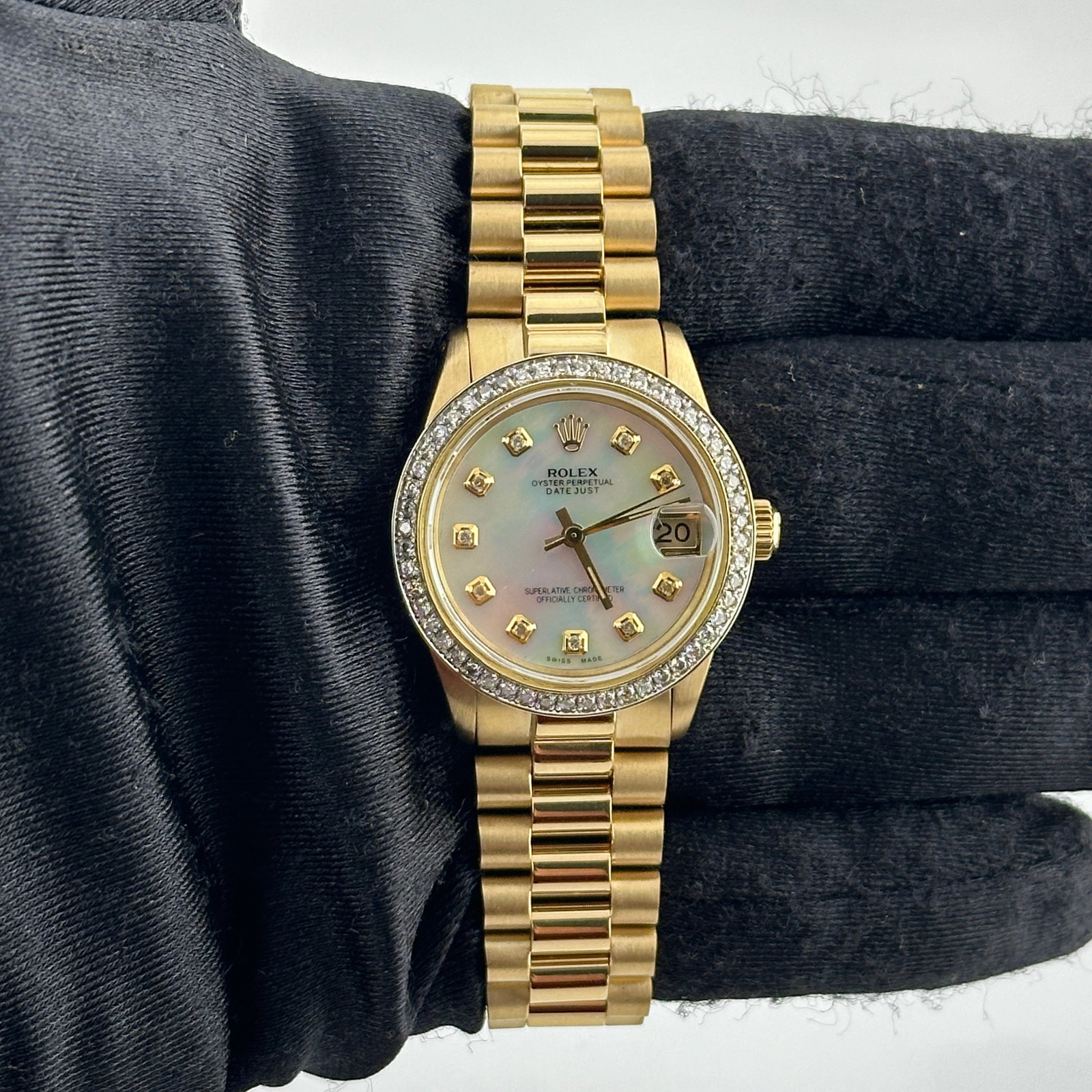 Ladies Datejust 6827 Aftermarket Mother of Pearl Diamond Dial on Aftermarket Presi 18K: Ladies Datejust 6827 Aftermarket Mother of Pearl Diamond Dial on Aftermarket Presi 18K This ladies Rolex Datejust features an aftermarket white mother-of-pearl diamond dial, a pave 10K diamond bezel, 