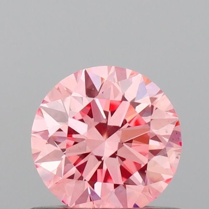 Ideal Loose Diamond - ROUND 0.52ct Fancy Vivid Pink VS1: Ideal Loose Diamond - ROUND 0.52ct Fancy Vivid Pink VS1 Source: This is a real non-mined Diamond that has been grown in a lab Shape: ROUND Carats: 0.52 Color: Fancy Vivid Pink Certification: IGI Video
