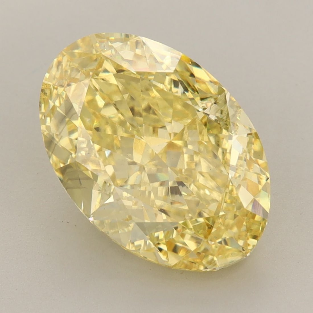Loose Diamond - OVAL 6.2ct Fancy Vivid Yellow VS2: Loose Diamond - OVAL 6.2ct Fancy Vivid Yellow VS2 Source: This is a real non-mined Diamond that has been grown in a lab Shape: OVAL Carats: 6.2 Color: Fancy Vivid Yellow Certification: IGI Video: