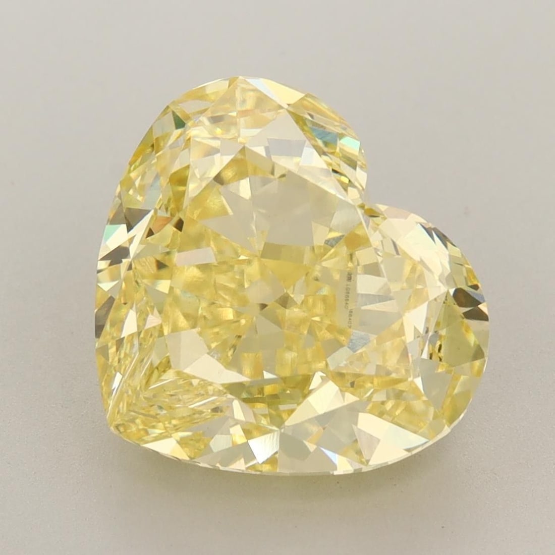 Loose Diamond - HEART 6.52ct Fancy Vivid Yellow VVS2: Loose Diamond - HEART 6.52ct Fancy Vivid Yellow VVS2 Source: This is a real non-mined Diamond that has been grown in a lab Shape: HEART Carats: 6.52 Color: Fancy Vivid Yellow Certification: IGI Video: