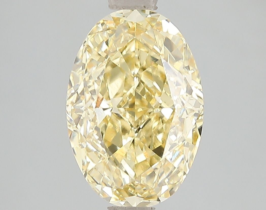 Loose Diamond - OVAL 3.11ct Fancy Vivid Yellow VVS2: Loose Diamond - OVAL 3.11ct Fancy Vivid Yellow VVS2 Source: This is a real non-mined Diamond that has been grown in a lab Shape: OVAL Carats: 3.11 Color: Fancy Vivid Yellow Certification: IGI Video: