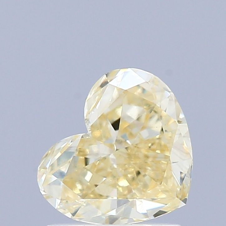 Loose Diamond - HEART 0.93ct Fancy Light Yellow VS1: Loose Diamond - HEART 0.93ct Fancy Light Yellow VS1 Source: This is a real non-mined Diamond that has been grown in a lab Shape: HEART Carats: 0.93 Color: Fancy Light Yellow Certification: IGI Video: