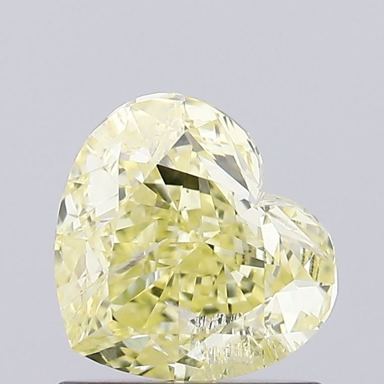 Loose Diamond - HEART 0.9ct Fancy Intense Yellow I1: Loose Diamond - HEART 0.9ct Fancy Intense Yellow I1 Source: This is a real non-mined Diamond that has been grown in a lab Shape: HEART Carats: 0.9 Color: Fancy Intense Yellow Certification: IGI Video: