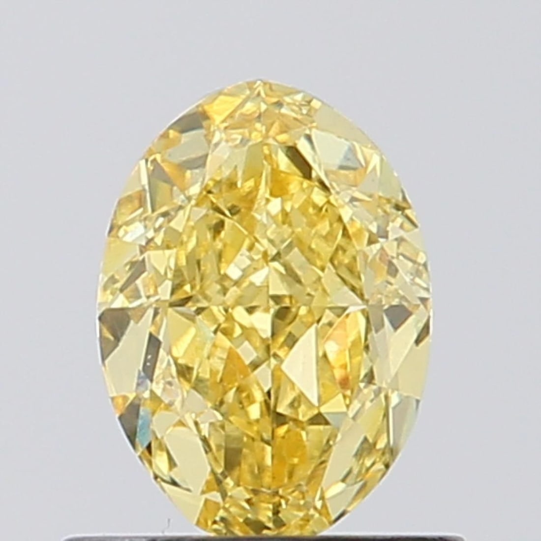 Loose Diamond - OVAL 0.89ct Fancy Vivid Yellow VVS2: Loose Diamond - OVAL 0.89ct Fancy Vivid Yellow VVS2 Source: This is a real non-mined Diamond that has been grown in a lab Shape: OVAL Carats: 0.89 Color: Fancy Vivid Yellow Certification: NONE Video: