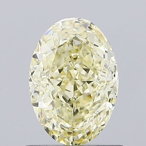 Loose Diamond - OVAL 1.04ct Fancy Light Yellow VS2: Loose Diamond - OVAL 1.04ct Fancy Light Yellow VS2 Source: This is a real non-mined Diamond that has been grown in a lab Shape: OVAL Carats: 1.04 Color: Fancy Light Yellow Certification: IGI Video: