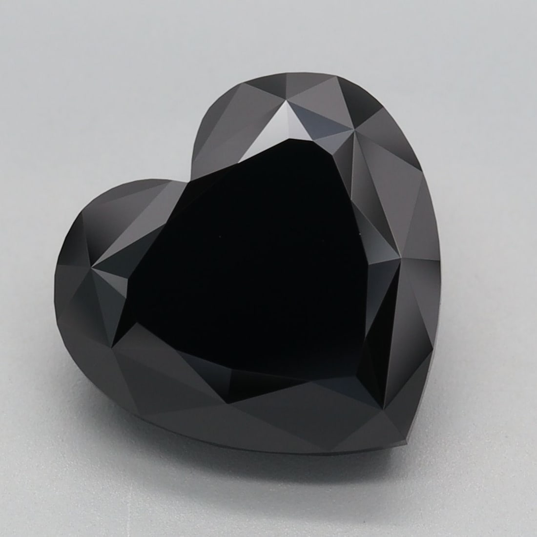 Loose Diamond - HEART 5.18ct Fancy Black: Loose Diamond - HEART 5.18ct Fancy Black Source: This is a real non-mined Diamond that has been grown in a lab Shape: HEART Carats: 5.18 Color: Fancy Black Certification: IGI Video: