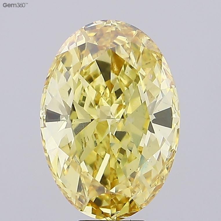 Loose Diamond - OVAL 10.03ct Fancy Vivid Yellow VS1: Loose Diamond - OVAL 10.03ct Fancy Vivid Yellow VS1 Source: This is a real non-mined Diamond that has been grown in a lab Shape: OVAL Carats: 10.03 Color: Fancy Vivid Yellow Certification: IGI Video: