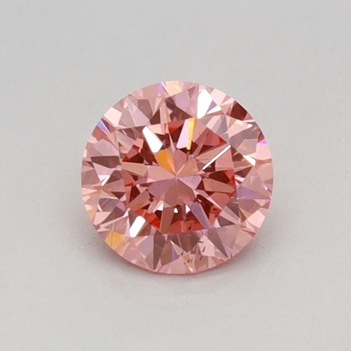Loose Diamond - ROUND 0.36ct Fancy Vivid Pink VS2: Loose Diamond - ROUND 0.36ct Fancy Vivid Pink VS2 Source: This is a real non-mined Diamond that has been grown in a lab Shape: ROUND Carats: 0.36 Color: Fancy Vivid Pink Certification: IGI Video: