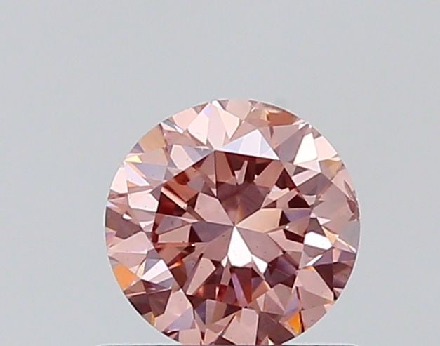 Loose Diamond - ROUND 0.58ct Fancy Vivid Pink VS2: Loose Diamond - ROUND 0.58ct Fancy Vivid Pink VS2 Source: This is a real non-mined Diamond that has been grown in a lab Shape: ROUND Carats: 0.58 Color: Fancy Vivid Pink Certification: NONE The Diamon