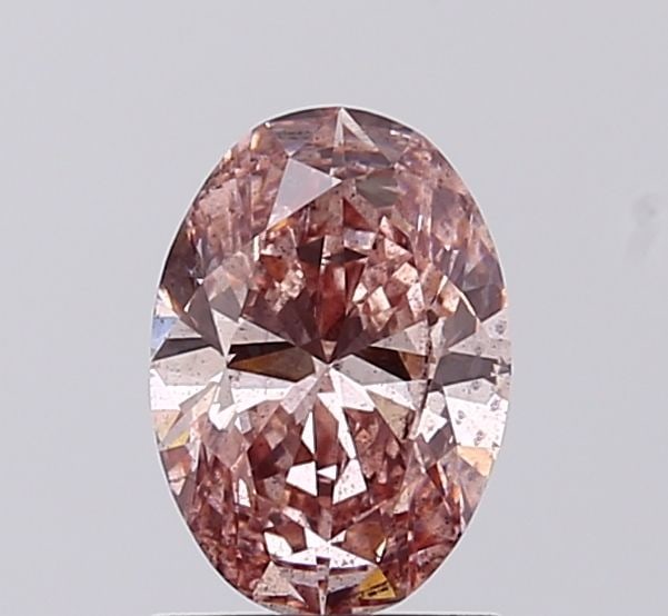 Loose Diamond - OVAL 1.0ct Fancy Vivid Brownish Pink I1: Loose Diamond - OVAL 1.0ct Fancy Vivid Brownish Pink I1 Source: This is a real non-mined Diamond that has been grown in a lab Shape: OVAL Carats: 1.0 Color: Fancy Vivid Brownish Pink Certification: IG