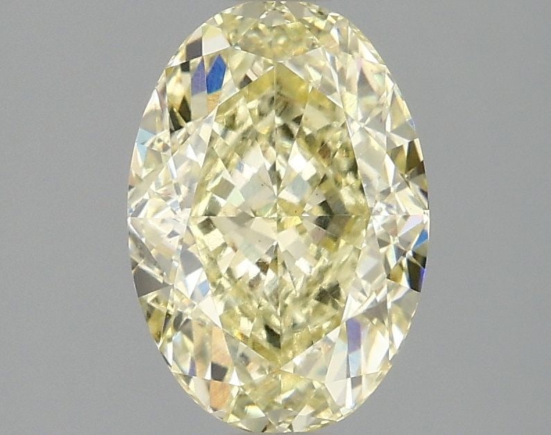 Loose Diamond - OVAL 2.1ct Fancy Light Yellow VS1: Loose Diamond - OVAL 2.1ct Fancy Light Yellow VS1 Source: This is a real non-mined Diamond that has been grown in a lab Shape: OVAL Carats: 2.1 Color: Fancy Light Yellow Certification: IGI Video: