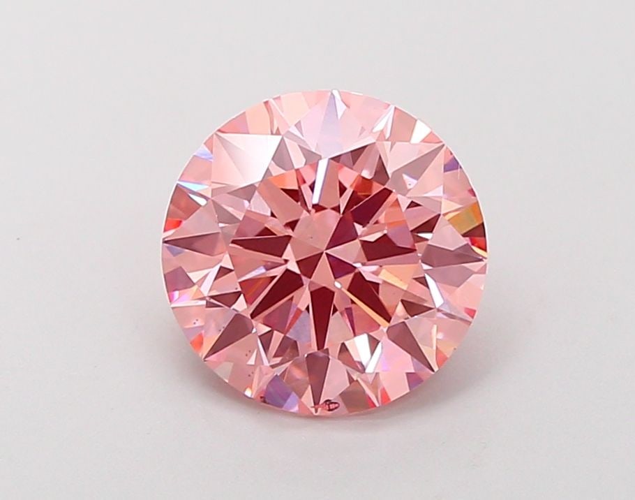 Ideal Loose Diamond - ROUND 2.53ct Fancy Vivid Pink VS2: Ideal Loose Diamond - ROUND 2.53ct Fancy Vivid Pink VS2 Source: This is a real non-mined Diamond that has been grown in a lab Shape: ROUND Carats: 2.53 Color: Fancy Vivid Pink Certification: IGI Video