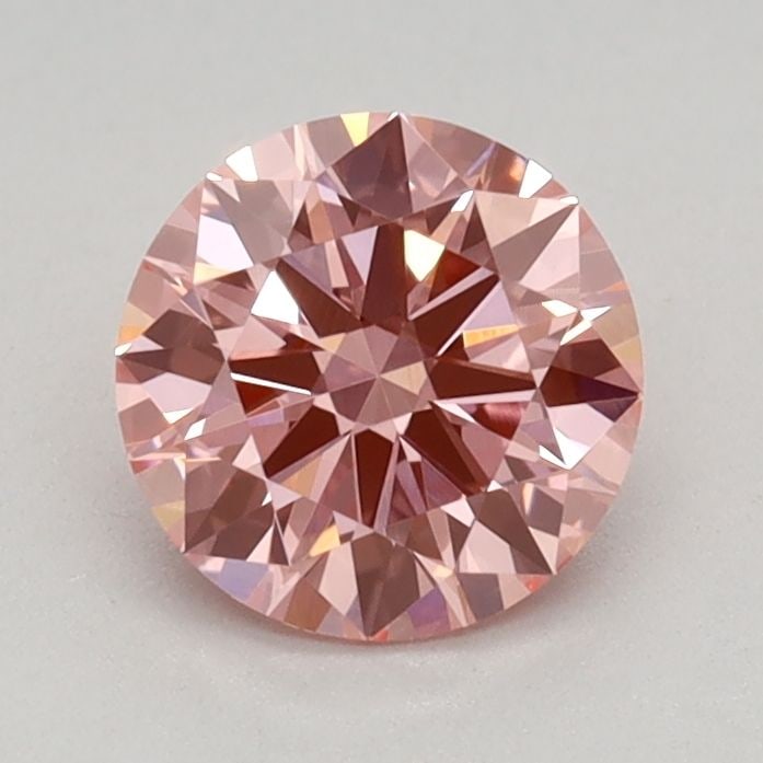Ideal Loose Diamond - ROUND 0.68ct Fancy Vivid Pink VVS2: Ideal Loose Diamond - ROUND 0.68ct Fancy Vivid Pink VVS2 Source: This is a real non-mined Diamond that has been grown in a lab Shape: ROUND Carats: 0.68 Color: Fancy Vivid Pink Certification: IGI Vide