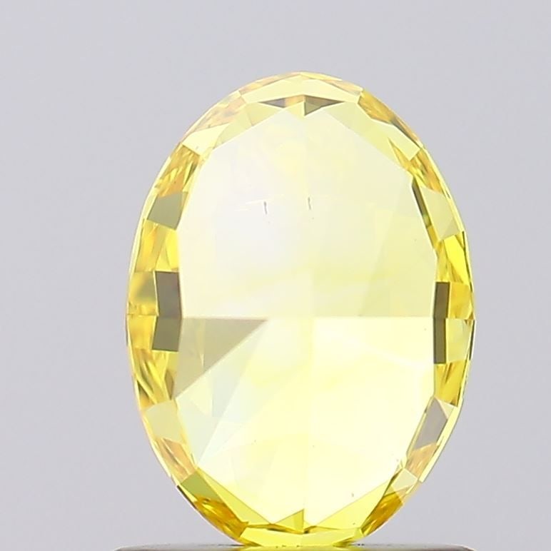 Loose Diamond - OVAL 1.05ct Fancy Vivid Yellow VS1: Loose Diamond - OVAL 1.05ct Fancy Vivid Yellow VS1 Source: This is a real non-mined Diamond that has been grown in a lab Shape: OVAL Carats: 1.05 Color: Fancy Vivid Yellow Certification: IGI Video: