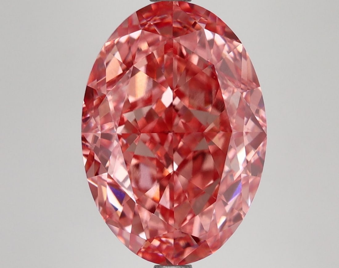Loose Diamond - OVAL 7.14ct Fancy Vivid Pink VVS2: Loose Diamond - OVAL 7.14ct Fancy Vivid Pink VVS2 Source: This is a real non-mined Diamond that has been grown in a lab Shape: OVAL Carats: 7.14 Color: Fancy Vivid Pink Certification: IGI Video: