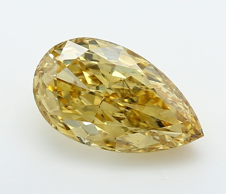 Loose Diamond - PEAR 3.03ct Fancy Vivid Yellow VS2: Loose Diamond - PEAR 3.03ct Fancy Vivid Yellow VS2 Source: This is a real non-mined Diamond that has been grown in a lab Shape: PEAR Carats: 3.03 Color: Fancy Vivid Yellow Certification: IGI Video: