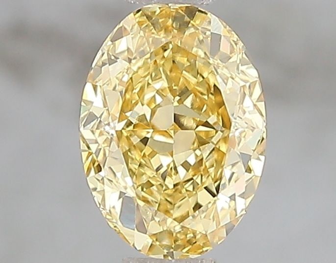Loose Diamond - OVAL 1.08ct Fancy Vivid Yellow VS1: Loose Diamond - OVAL 1.08ct Fancy Vivid Yellow VS1 Source: This is a real non-mined Diamond that has been grown in a lab Shape: OVAL Carats: 1.08 Color: Fancy Vivid Yellow Certification: IGI The Diamo