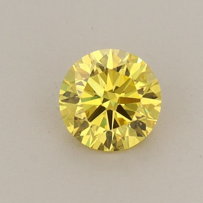Loose Diamond - ROUND 0.43ct Fancy Vivid Yellow VS1: Loose Diamond - ROUND 0.43ct Fancy Vivid Yellow VS1 Source: This is a real non-mined Diamond that has been grown in a lab Shape: ROUND Carats: 0.43 Color: Fancy Vivid Yellow Certification: IGI Video: