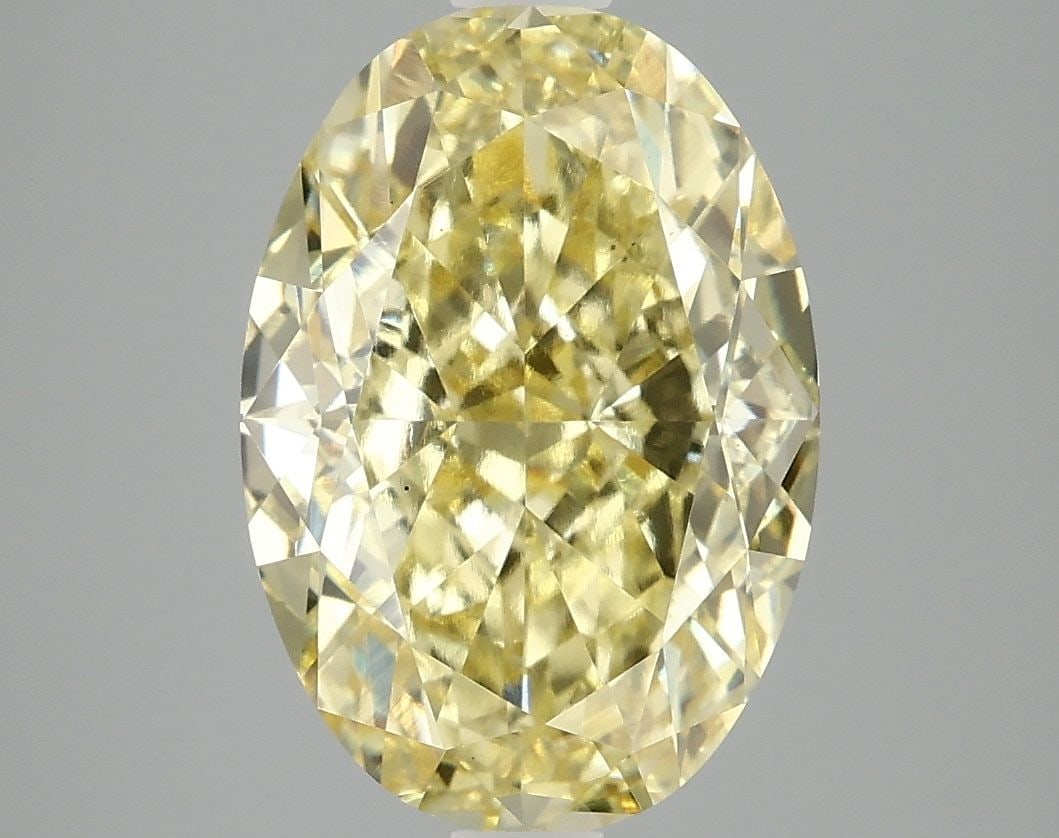 Loose Diamond - OVAL 5.09ct Fancy Vivid Yellow VS1: Loose Diamond - OVAL 5.09ct Fancy Vivid Yellow VS1 Source: This is a real non-mined Diamond that has been grown in a lab Shape: OVAL Carats: 5.09 Color: Fancy Vivid Yellow Certification: IGI Video: