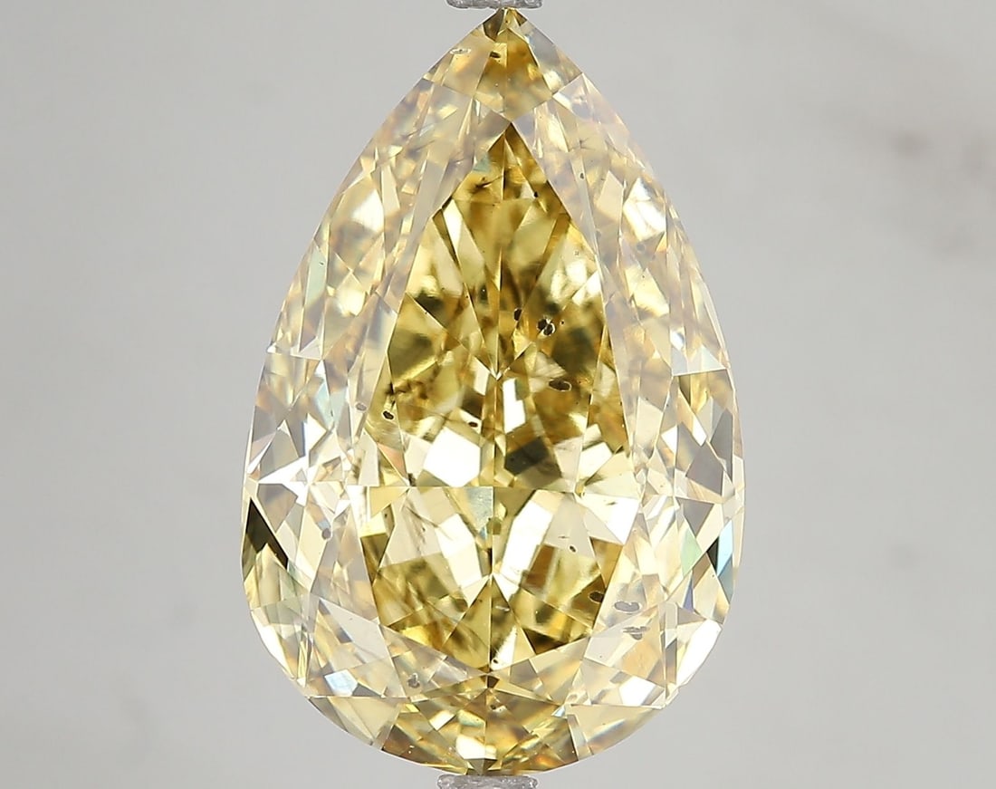 Loose Diamond - PEAR 10.54ct Fancy Vivid Yellow SI1: Loose Diamond - PEAR 10.54ct Fancy Vivid Yellow SI1 Source: This is a real non-mined Diamond that has been grown in a lab Shape: PEAR Carats: 10.54 Color: Fancy Vivid Yellow Certification: IGI Video: