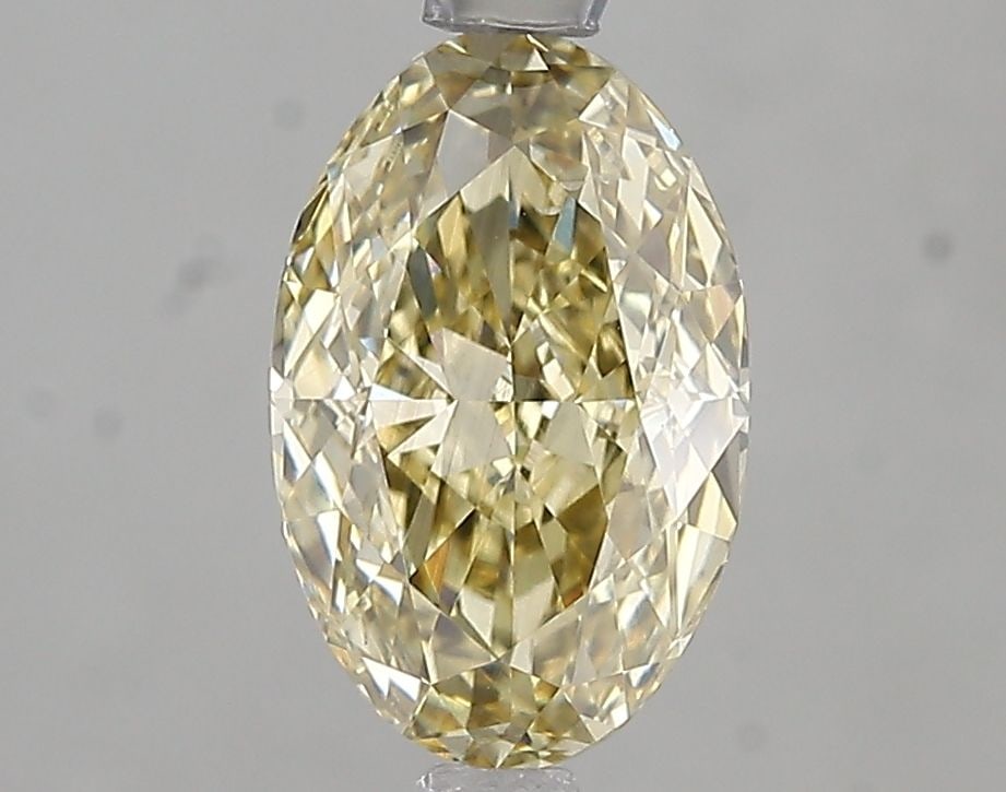 Loose Diamond - OVAL 1.8ct Fancy Yellow VS2: Loose Diamond - OVAL 1.8ct Fancy Yellow VS2 Source: This is a real non-mined Diamond that has been grown in a lab Shape: OVAL Carats: 1.8 Color: Fancy Yellow Certification: IGI Video: