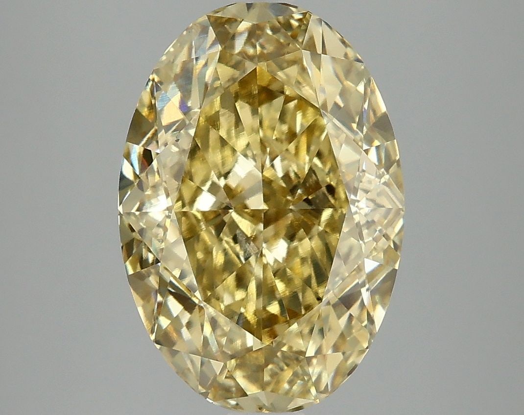 Loose Diamond - OVAL 5.01ct Fancy Vivid Yellow VS1: Loose Diamond - OVAL 5.01ct Fancy Vivid Yellow VS1 Source: This is a real non-mined Diamond that has been grown in a lab Shape: OVAL Carats: 5.01 Color: Fancy Vivid Yellow Certification: IGI Video: