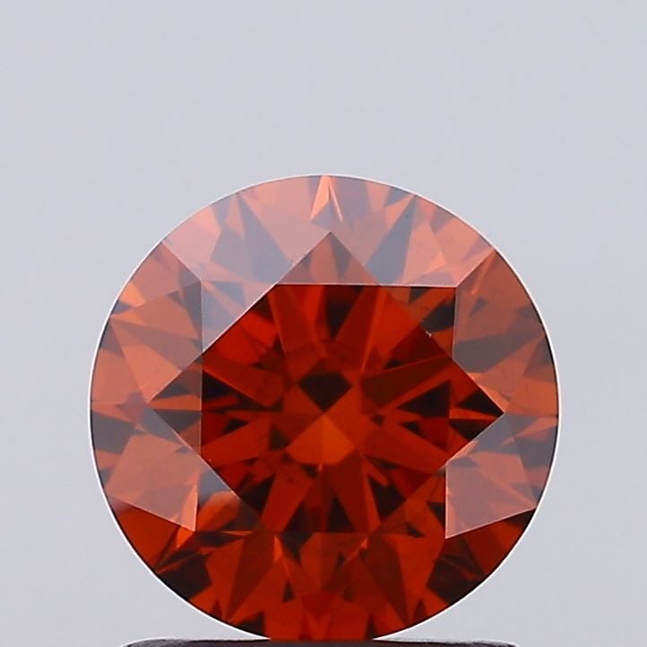Loose Diamond - ROUND 1.23ct Fancy Vivid Orange VS2: Loose Diamond - ROUND 1.23ct Fancy Vivid Orange VS2 Source: This is a real non-mined Diamond that has been grown in a lab Shape: ROUND Carats: 1.23 Color: Fancy Vivid Orange Certification: IGI Video: