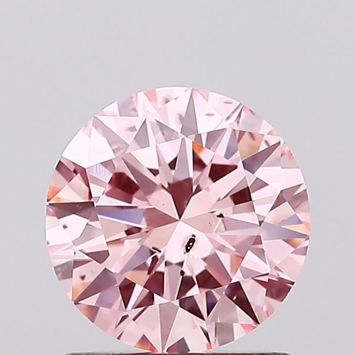 Loose Diamond - ROUND 0.99ct Fancy Vivid Pink SI1: Loose Diamond - ROUND 0.99ct Fancy Vivid Pink SI1 Source: This is a real non-mined Diamond that has been grown in a lab Shape: ROUND Carats: 0.99 Color: Fancy Vivid Pink Certification: IGI Video:
