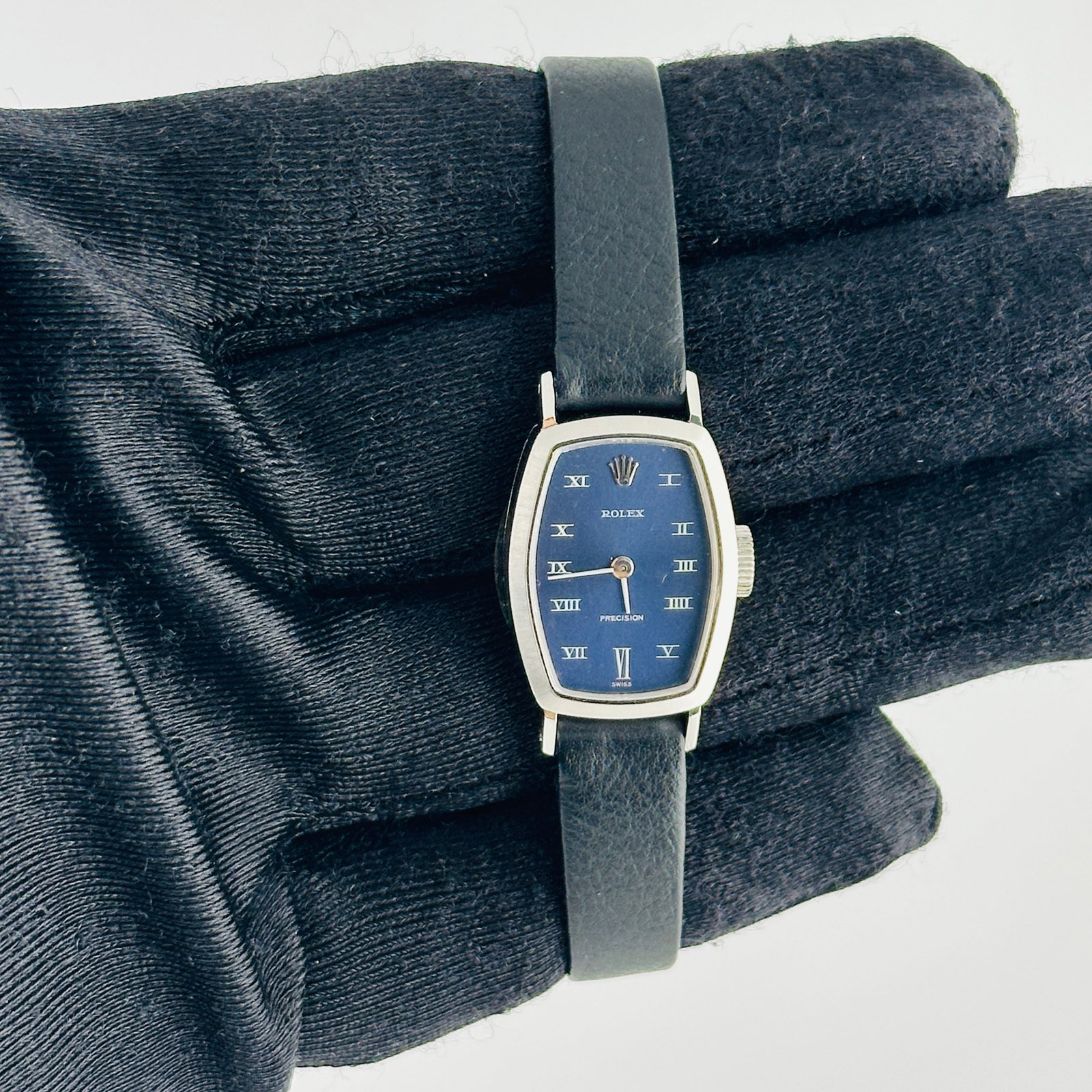 Ladies Rolex Precision 2648 Blue Roman Dial Aftermarket Leather Strap: Ladies Rolex Precision 2648 Blue Roman Dial Aftermarket Leather Strap This Rolex Precision wristwatch features a blue dial with Roman numerals and a smooth bezel. It is fitted with an aftermarket leat