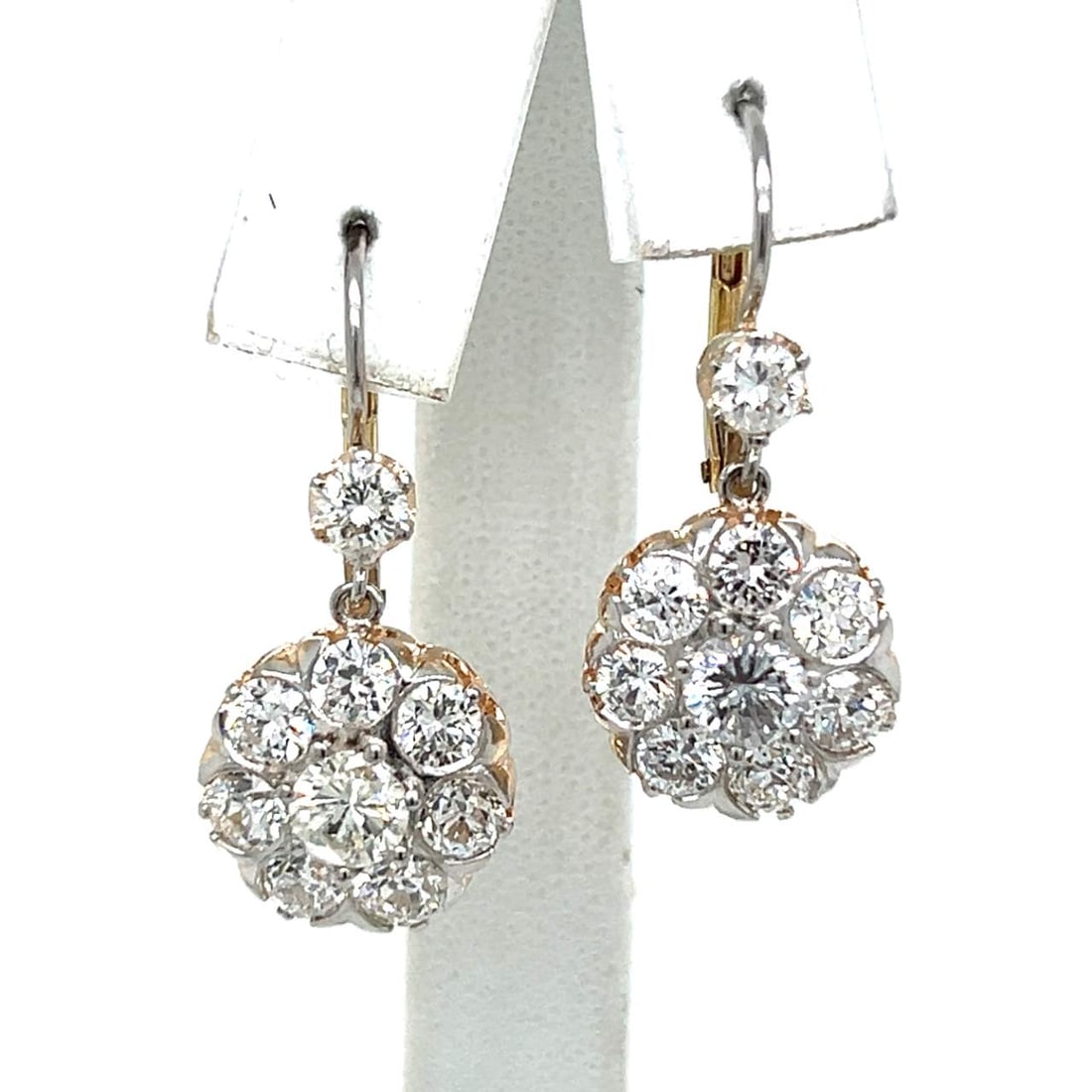 18K Yellow Gold Platinum 5.30 Ct Diamond Cluster Earrings: 18K Yellow Gold Platinum 5.30 Ct Diamond Cluster Earrings These exquisite earrings feature a stunning combination of 18K yellow gold and platinum, elegantly showcasing a total diamond weight of 5.30