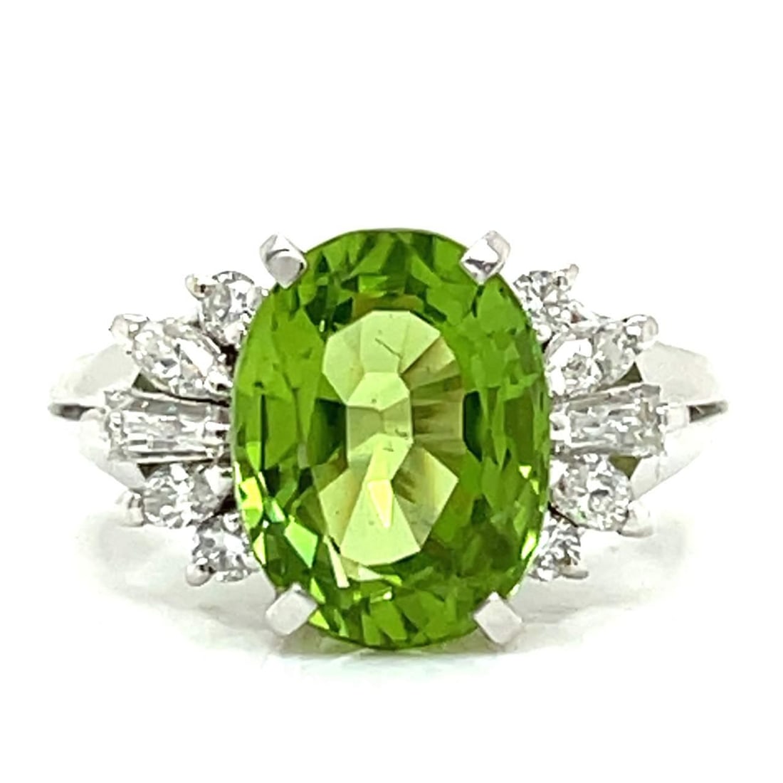 Stunning Platinum 4.11 Ct Peridot Diamond Ring: Stunning Platinum 4.11 Ct Peridot Diamond Ring This exquisite Platinum Peridot & Diamond Ring features a stunning 4.11 Ct. Peridot at its center, surrounded by 10 sparkling Diamonds totaling 0.44 Ct. 