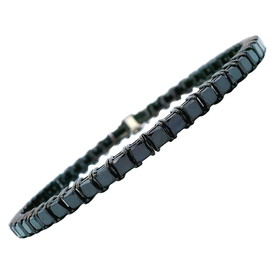 11.87ct Black Diamond Tennis Bracelet 14k White Gold: 11.87ct Black Diamond Tennis Bracelet 14k White Gold This stunning contemporary tennis bracelet features 52 sparkling princess cut black diamonds, totaling 11.87 carats. Crafted from luxurious 14-kara