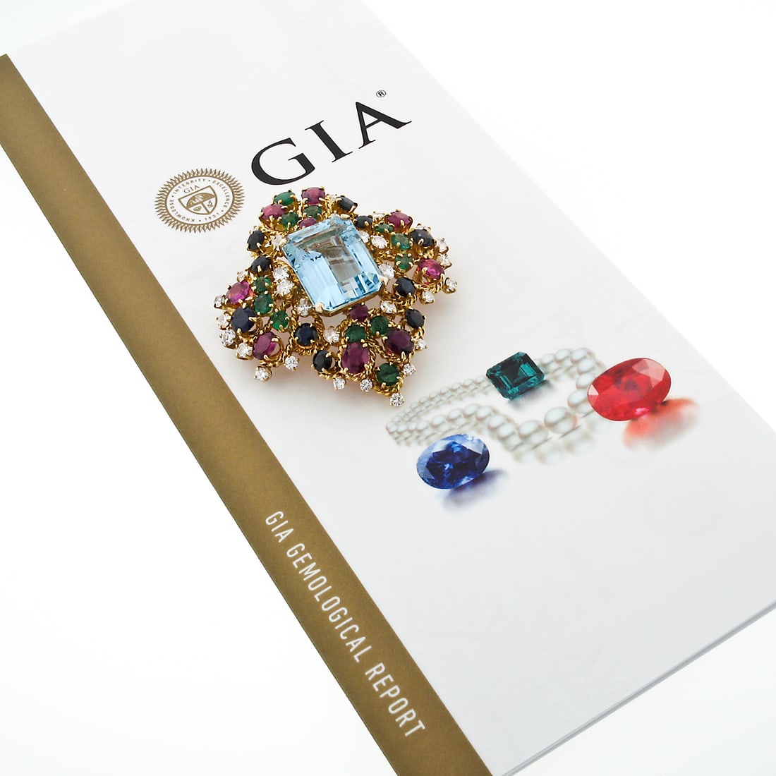 GIA Certified 18k Gold Floral Brooch with Aquamarine Sapphires Rubies Emeralds Diamonds: GIA Certified 18k Gold Floral Brooch with Aquamarine Sapphires Rubies Emeralds Diamonds Discover a truly exquisite vintage brooch, masterfully handcrafted from solid 18k yellow gold. This stunning