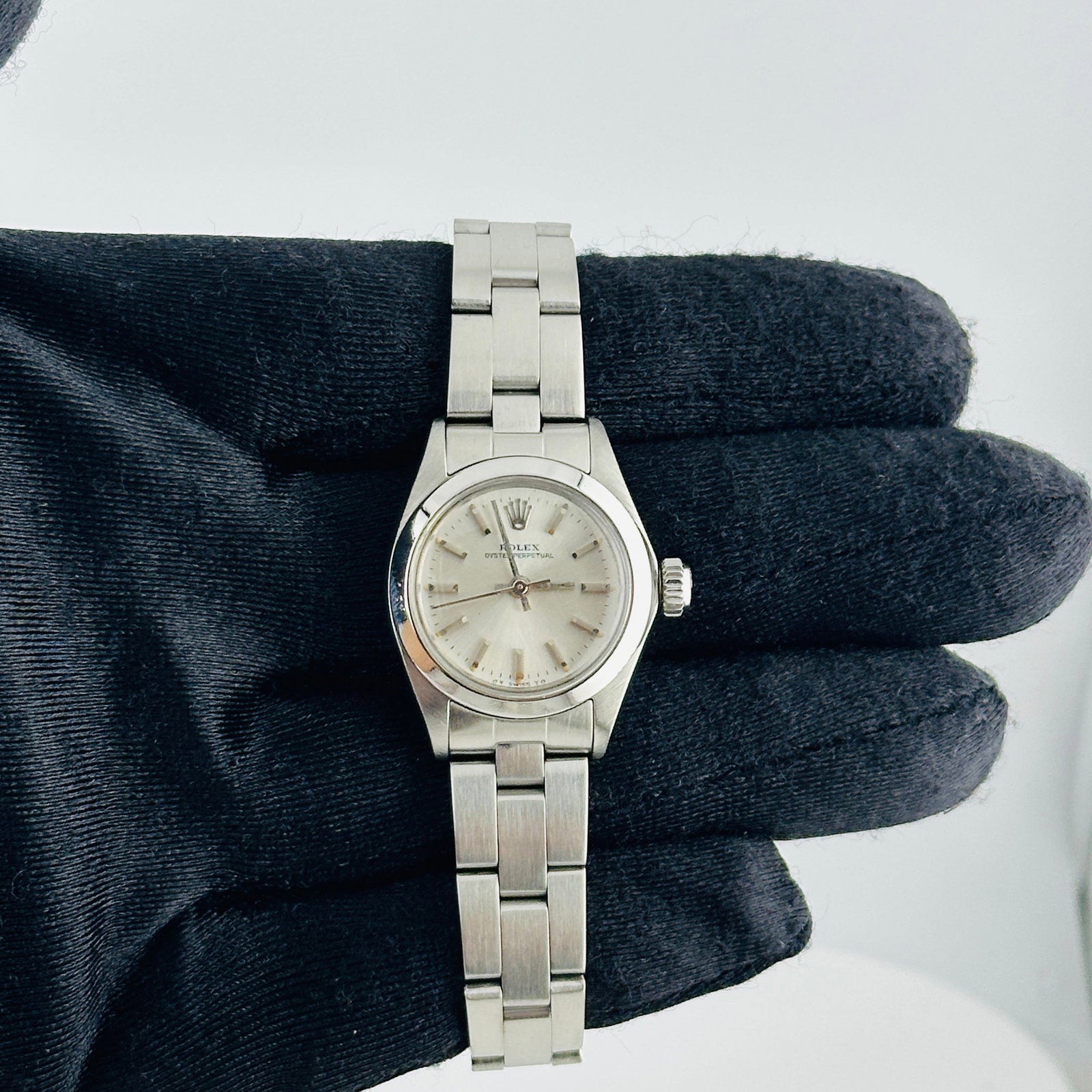 Ladies Rolex Oyster Perpetual Ref 6718 Silver Stick Sigma Dial Oyster Bracelet: Ladies Rolex Oyster Perpetual Ref 6718 Silver Stick Sigma Dial Oyster Bracelet This Rolex Oyster Perpetual wristwatch features a silver stick Sigma dial, complemented by a smooth bezel and is fitted w