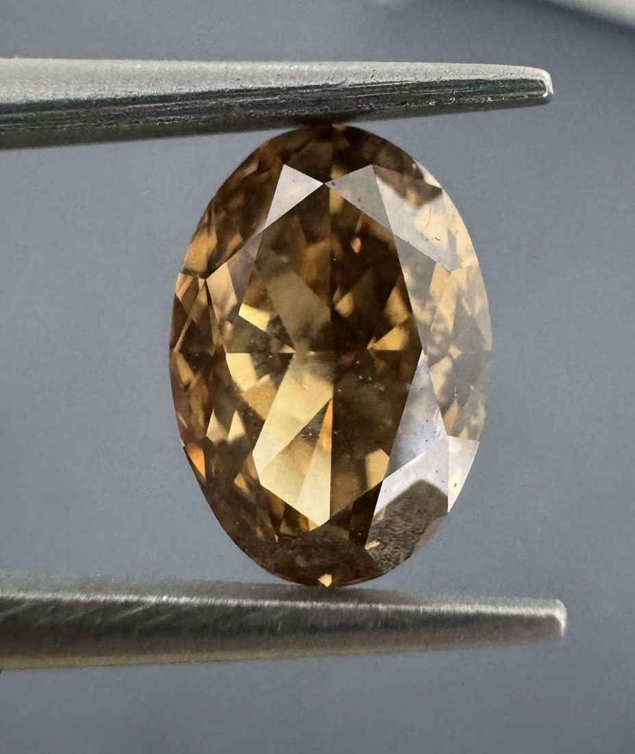 Loose Diamond - OVAL 1.26ct Fancy Orange Brown VS1: Loose Diamond - OVAL 1.26ct Fancy Orange Brown VS1 Source: Natural Shape: OVAL Carats: 1.26 Color: Fancy Orange Brown Certification: GIA Video: Video Link The Diamond Depot Guarantee: All items in