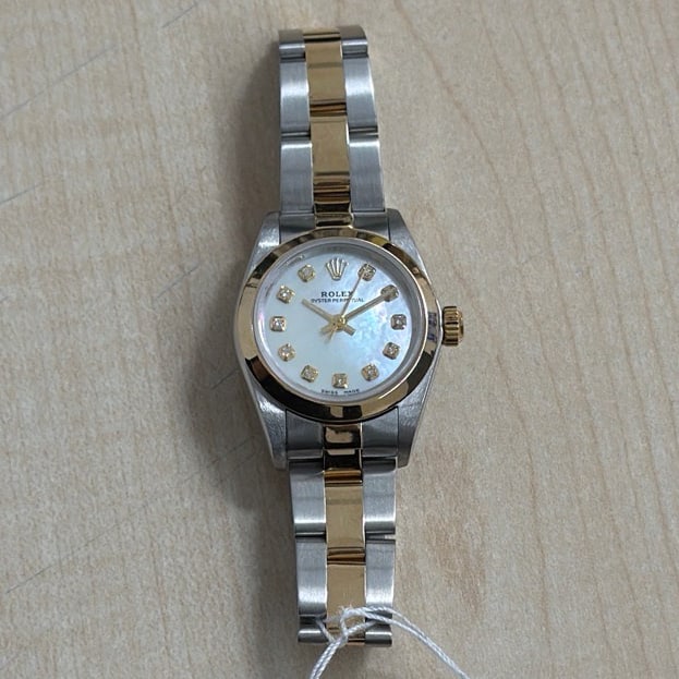 Ladies Rolex Oyster Perpetual Aftermarket Dial Yellow Diamond Markers Ref 76183: Ladies Rolex Oyster Perpetual Aftermarket Dial Yellow Diamond Markers Ref 76183 This Rolex Oyster Perpetual watch features a slate dial with gold markers, complemented by a smooth bezel and an Oyster-