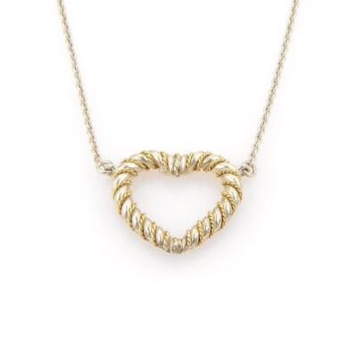 Tiffany & Co. Heart Pendant Necklace Sterling Silver 18k Yellow Gold: Tiffany & Co. Heart Pendant Necklace Sterling Silver 18k Yellow Gold This exquisite necklace from Tiffany & Co. showcases a stunning heart pendant crafted from sterling silver and adorned with 18k yel