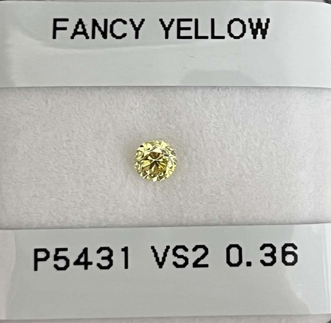 Loose Diamond - ROUND 0.36ct Fancy Yellow VS2: Loose Diamond - ROUND 0.36ct Fancy Yellow VS2 Source: Natural Shape: ROUND Carats: 0.36 Color: Fancy Yellow Certification: GIA Video: Video Link The Diamond Depot Guarantee: All items in this auction