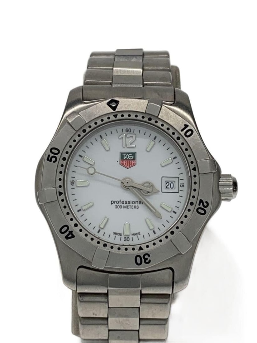 TAG Heuer Quartz Stainless Steel White Dial Wristwatch WK1311-1: TAG Heuer Quartz Stainless Steel White Dial Wristwatch WK1311-1 This TAG Heuer Professional Quartz WK1311-1 men's wristwatch features a stainless steel case and band with a white dial. The watch is Sw